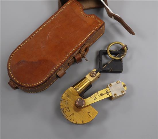 A leather cased Palmer Military clinometer